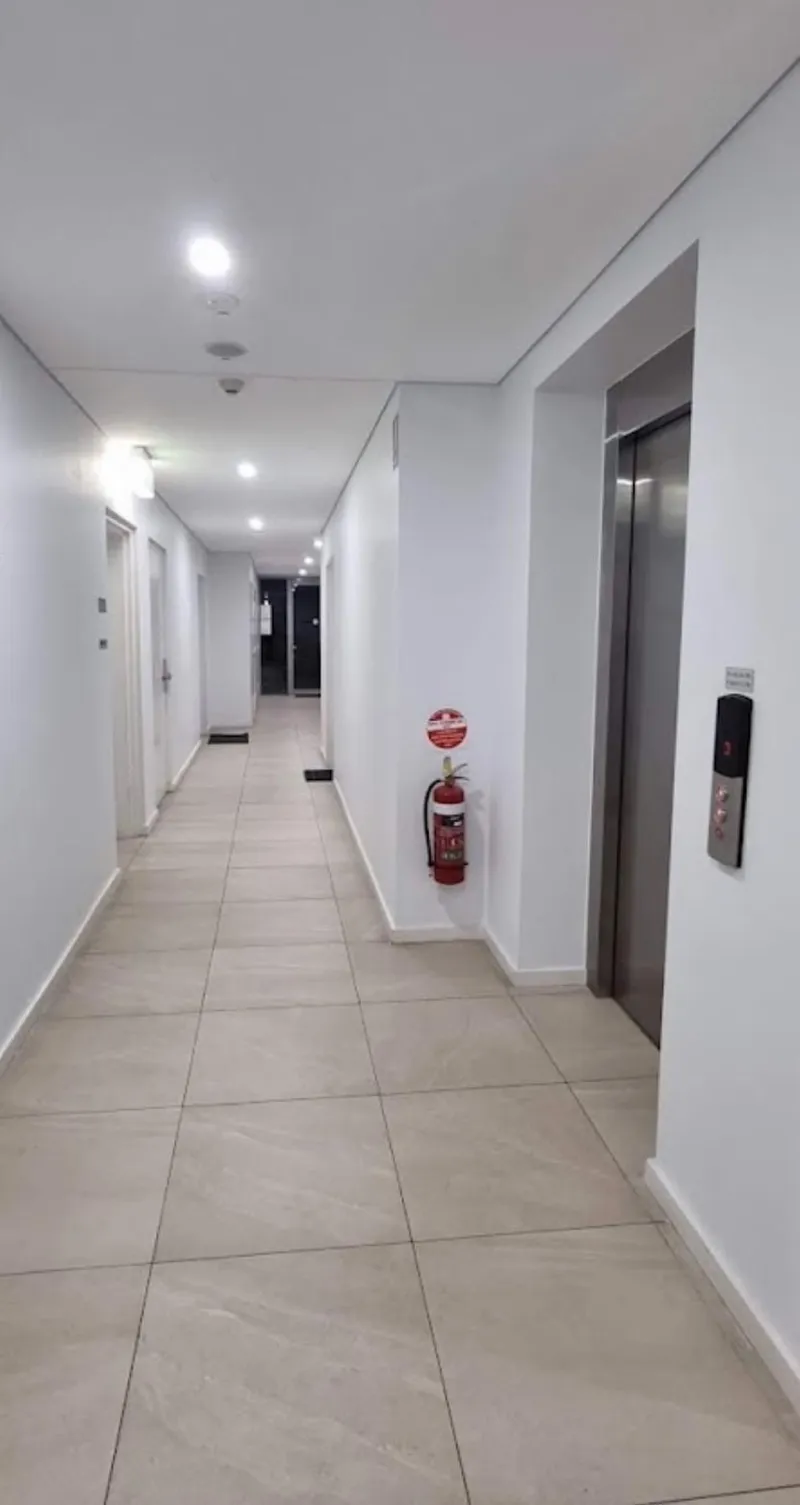 Apartment building corridor with freshly painted walls and doors
