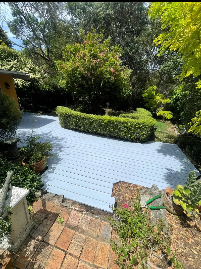 Garden deck coated in pale blue-grey